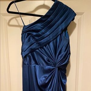 Adrianna Papel asymmetric over the shoulder, deep blue flattering evening gown.